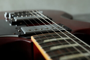 Fototapeta na wymiar Red electric guitar, close up and selective focus
