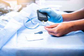 a nurse doing herself hand a finger stick hemoglobin and hematocrit test, blood test in hospital