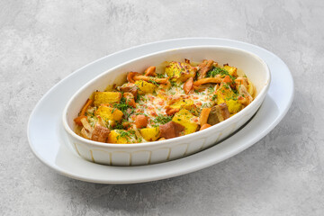 Casserole with honey agarics, pumpkin and potatoes