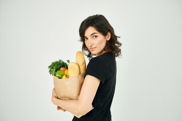 pretty woman with food package healthy food vegetables light background