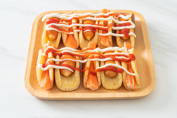 flat pancake roll with sausage and crab stick