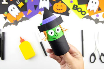 Craft with a child for Halloween from rolls of toilet paper and colored paper witch. Step-by-step instruction. Step 2.