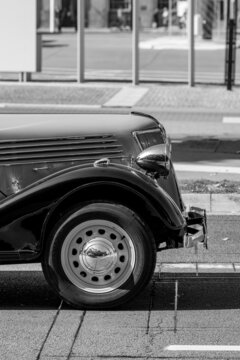 Black and white image of the tire of old retro car, Bruges, Belgium