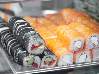 rows of rolls in the restaurant window, take away. Traditional asian food