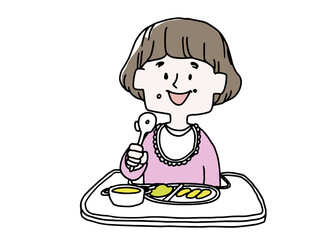 自分でスプーンを持って食べ始めた女の子