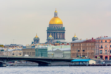 Fototapeta na wymiar English embankment and dome of St. Isaac's Cathedral, Saint Petersburg, Russia