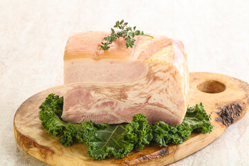 Cut of pork bacon over board