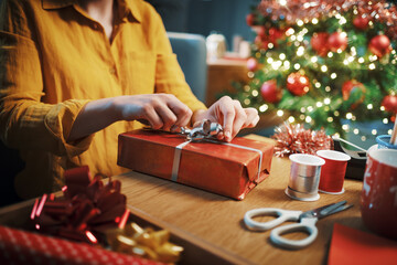 Woman preparing Christmas gifts at home