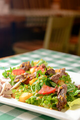 Salad with beef, tomatoes, fresh lettuce salad and arugula, raw mushrooms and great dressing from dijon mustard.