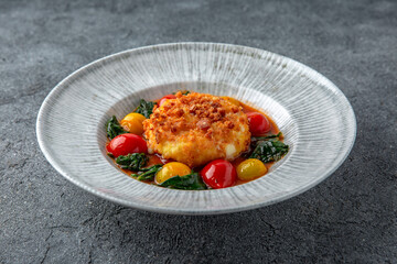Chopped meat cutlet baked with cheese and grilled vegetables. Ready menu for the restaurant. Neutral gray blue textured background