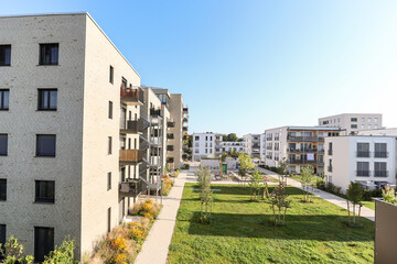 Cityscape of a residential area with modern apartment buildings, new green urban landscape in the city - 456874440