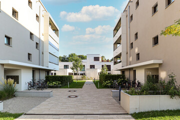 Cityscape of a residential area with modern apartment buildings, new green urban landscape in the...