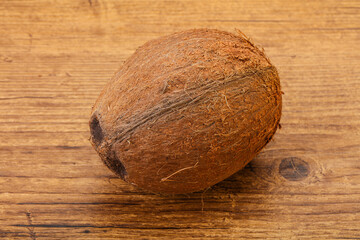 Tropical brown coconut over background