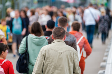 Crowd of people on the street. Summer day