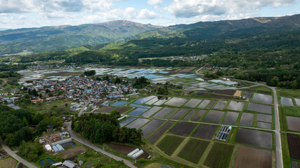 Freshly filled paddy fields on a gentle slope A