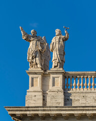 Fototapeta na wymiar Statues on the roof of the Papal Archbasilica of St. John in Lateran (Basilica di San Giovanni in Laterano), Italy, Rome