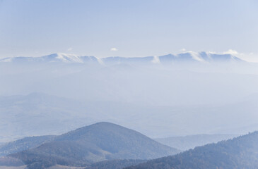 Fototapeta premium View of peaks of Borzhava ridge covered in white cloud