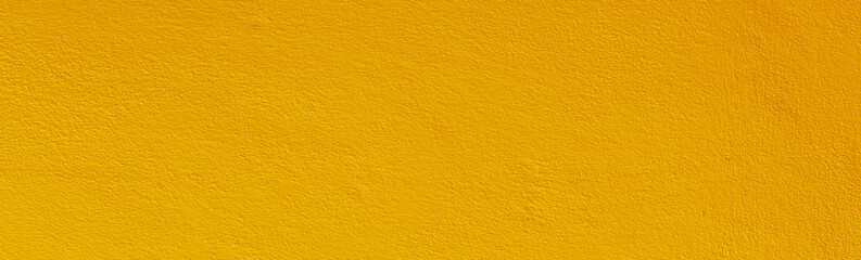 Yellow color old grunge wall concrete texture as background.