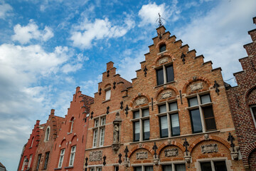 Fototapeta na wymiar Beautiful triangular fronts of buildings, street view, Bruges, Belgium