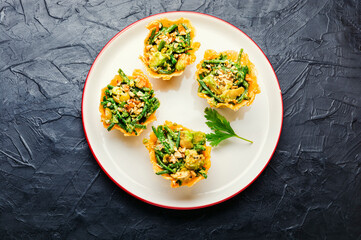 Salad in cheese basket with vegetables