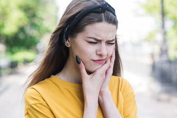 Portrait of a Caucasian teen girl who has a toothache. Healthcare. Medicine.