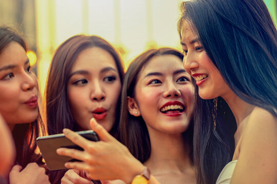 Photo of happy group of friends standing  looking aside make a selfie..Happy friends taking photo gathering. young smiling teenagers having fun together