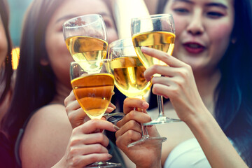 Party time start. Happy people toasting with champagne flutes. Multiethnic friends congratulating each other with new year. Celebration holiday concept, holiday background. selective focus