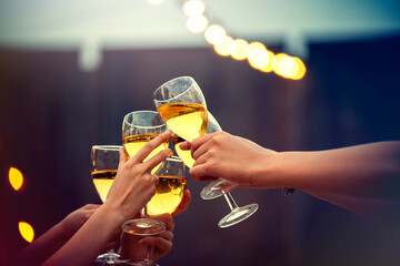 Party time start. Happy people toasting with champagne flutes. Multiethnic friends congratulating each other with new year. Celebration holiday concept, holiday background. selective focus