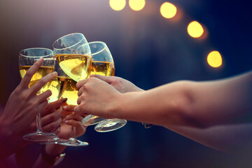 Party time start. Happy people toasting with champagne flutes. Multiethnic friends congratulating each other with new year. Celebration holiday concept, holiday background. selective focus