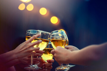 Party time start. Happy people toasting with champagne flutes. Multiethnic friends congratulating each other with new year. Celebration holiday concept, holiday background. selective focus