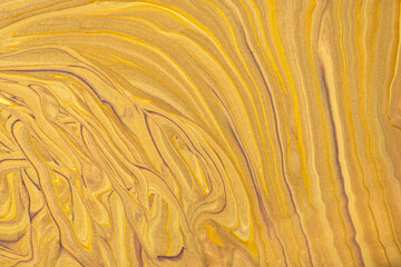 Abstract fluid art background dark golden and yellow colors. Liquid marble. Acrylic painting with...