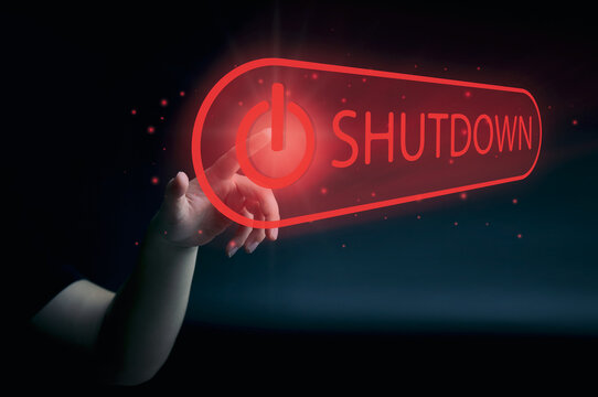 human hand presses the shutdown button on the virtual screen. concept of a system shutdown or stops working. with space to copy or design business