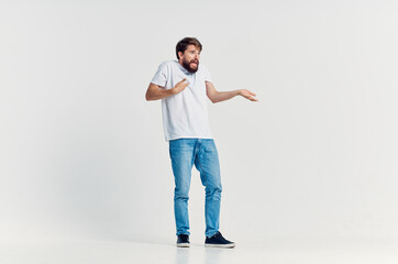 young man emotions posing light background