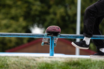 Close up of a skateboarders feet while skating on concrete at the skate park