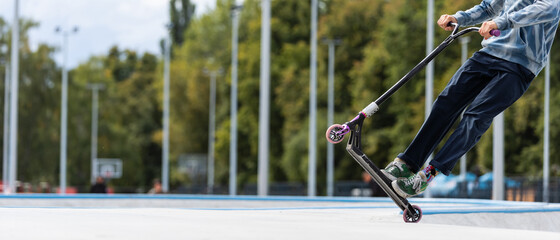 child going airborne with his scooter