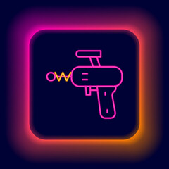 Glowing neon line Ray gun icon isolated on black background. Laser weapon. Space blaster. Colorful outline concept. Vector