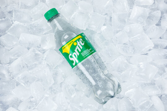 Sprite lemonade soft drink in a plastic bottle on ice cubes
