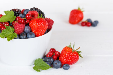 Berries fruits berry fruit strawberries strawberry blueberries blueberry on wooden board