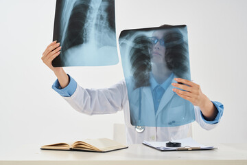 radiologist sitting at the table x-ray diagnostics treatment