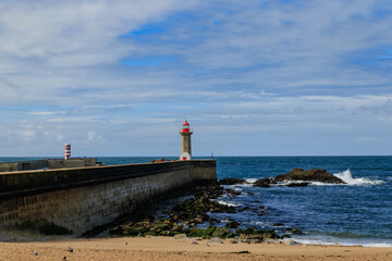 Felgueiras Lighthouse on a breakwater of Foz do Douro district of Porto city