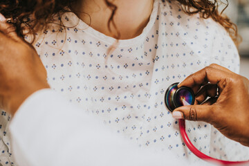 Physician examining a female patient