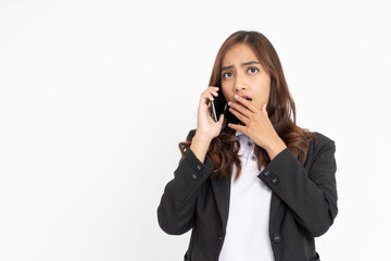 young asian businesswoman shocked and worried while making a phone call