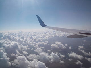 Fluffy clouds in the heaven, view from the aircraft 