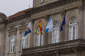 Fototapeta na wymiar Flags in motion on the balcony of an official organization