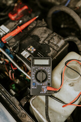 Voltage meter used to repair a car