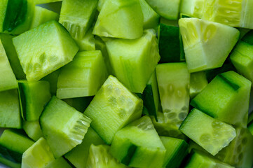 Dice of Cucumber, diced Cucumber background. Food background of vegetable texture. Ingredient for...