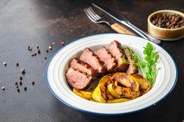 duck breast and garnish second course side dish fresh portion ready to eat meal snack on the table copy space food background rustic. top view keto or paleo diet