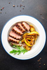 duck breast and garnish second course side dish fresh portion ready to eat meal snack on the table copy space food background rustic. top view keto or paleo diet