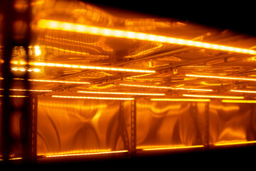machine for sticking film on mdf panel close-up, front and background blurred with bokeh effect