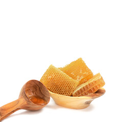 Honey concept. Pieces of bee comb in wooden bowl with wooden carved ladle.
